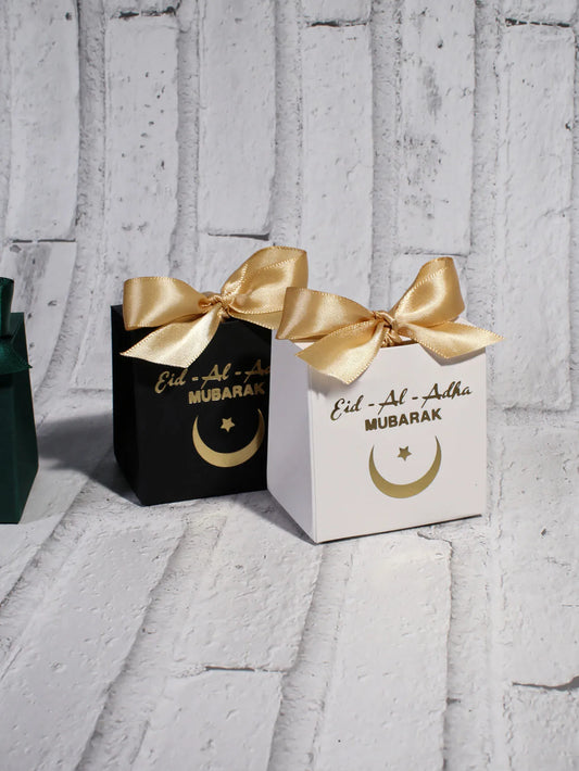Eid al Adha Gift Box with Golden Ribbon, featuring crescent and star patterns, perfect for gifting to friends and family